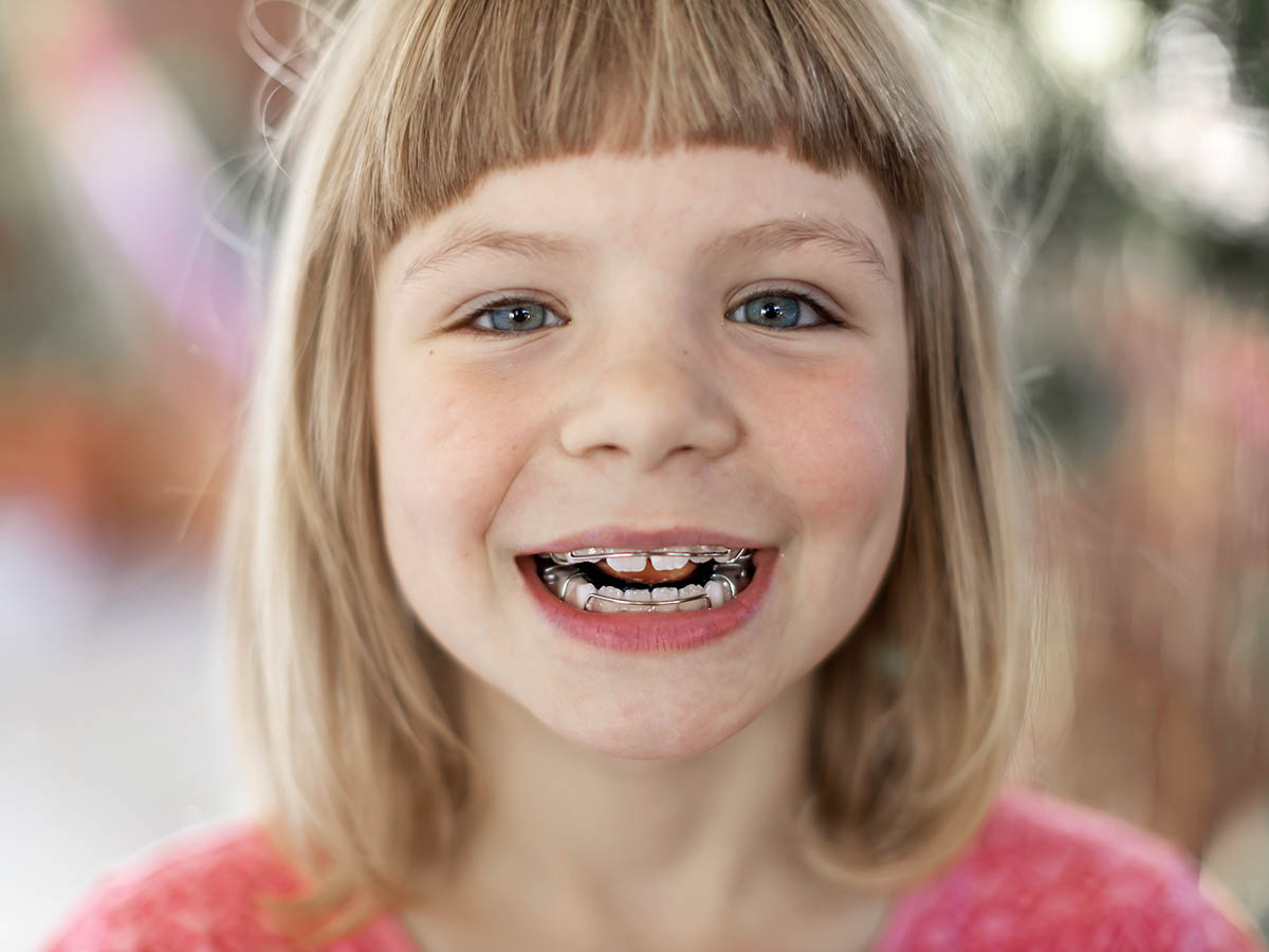 Portrait of smiling little girl with braces