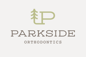 parkside orthodontics animated logo with tan background